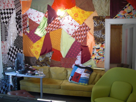 a wall covered in colored fabrics